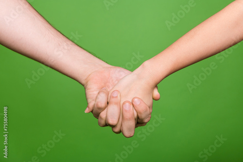 Photo of two people arms palms walking holding hands support each other isolated green color background