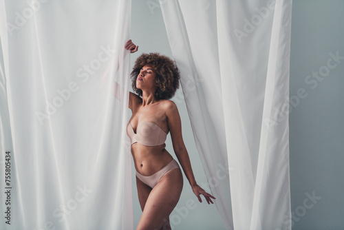 Unretouched photo of attractive lady with body fat folds feel self confident wear lingerie isolated grey veil color background © deagreez
