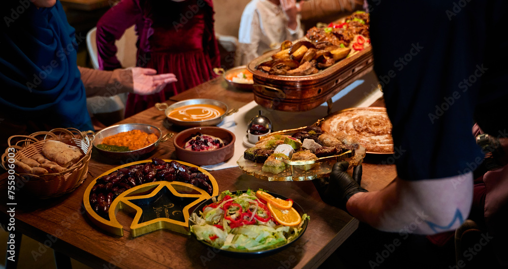 In this captivating aerial view, delicious food adorned with Ramadan decorations, including dates and meat, awaits the arrival of an European Islamic family, promising a festive and flavorful iftar