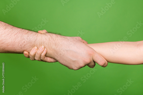Photo of two people arms palms support each other showing partnership isolated green color background