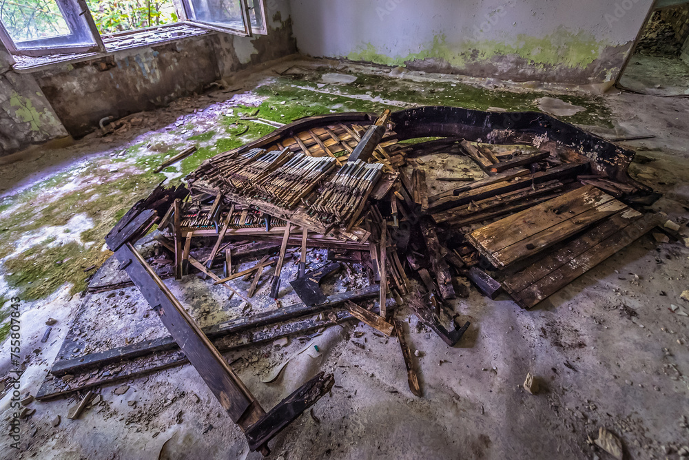 Destroyed piano in music school in Pripyat abandoned city in Chernobyl Exclusion Zone, Ukraine