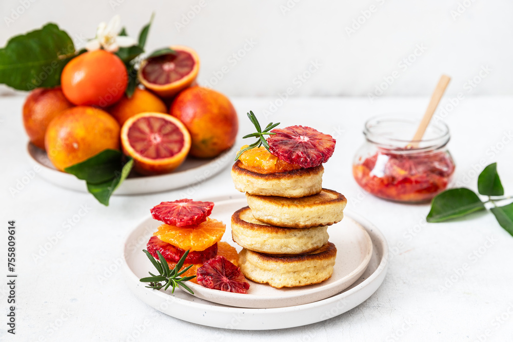 Stack of pancakes with blood orange and honey 