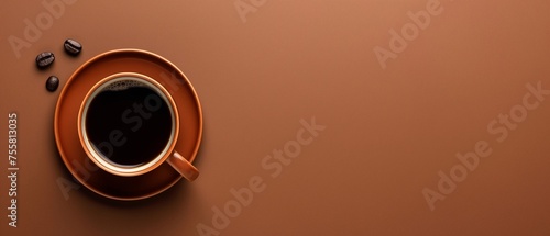 top view of coffee cup on brown background, hot black coffee photo