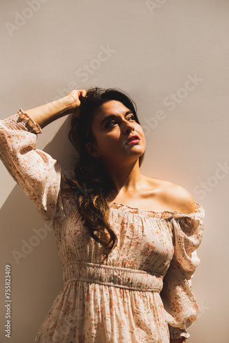 Woman leaning against wall