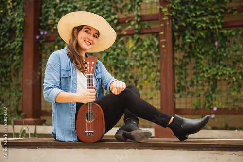woman sitting with ukulele