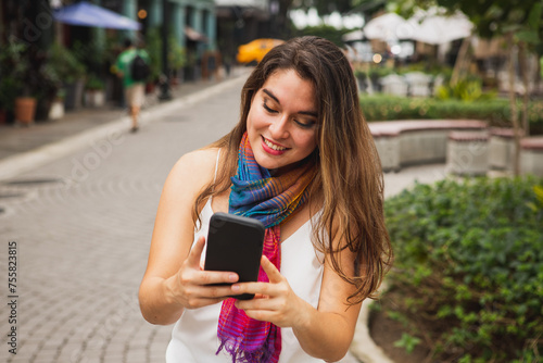 Woman texting on cell phone