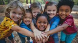 Joyful diverse kids huddled in a group. Children's unity and teamwork concept for social unity and educational projects. Outdoor shot with focus on happiness and diversity
