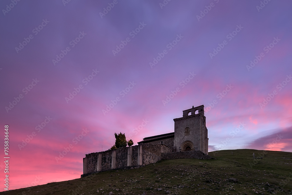 Fototapeta premium Hermitage of San Pantaleón de Losa in the Losa valley, Burgos, with a sky of intense colors