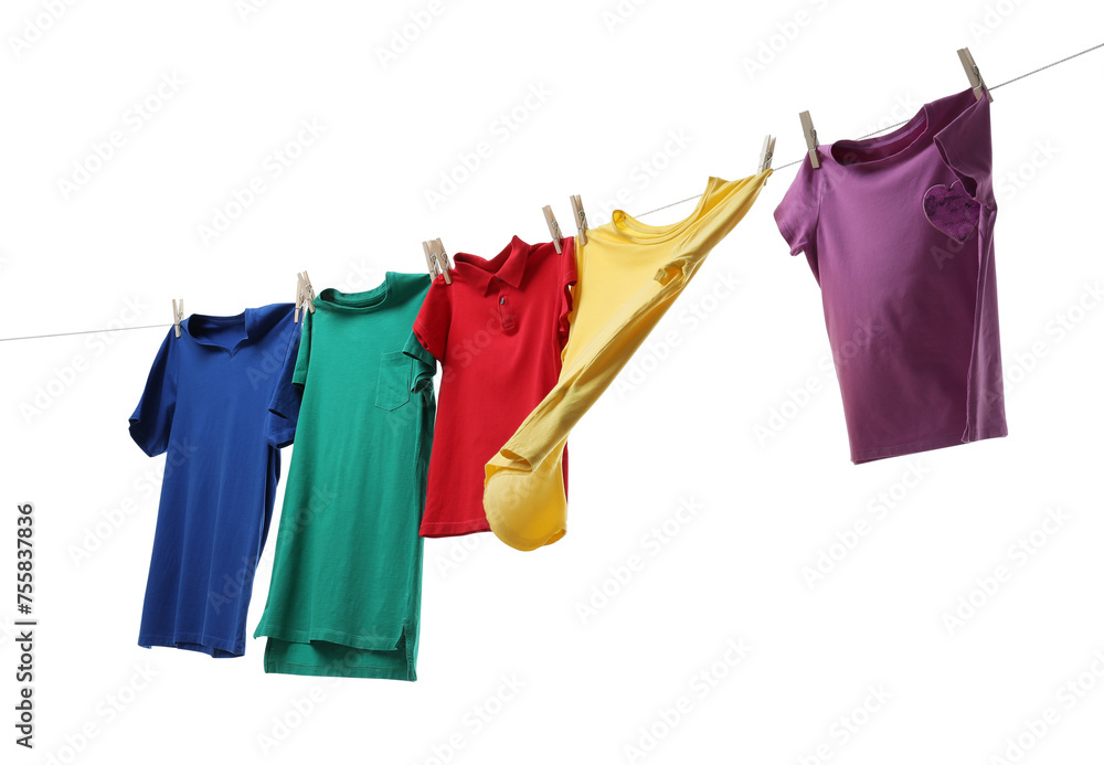Colorful t-shirts drying on washing line isolated on white Colorful t-shirts drying on washing line isolated on white