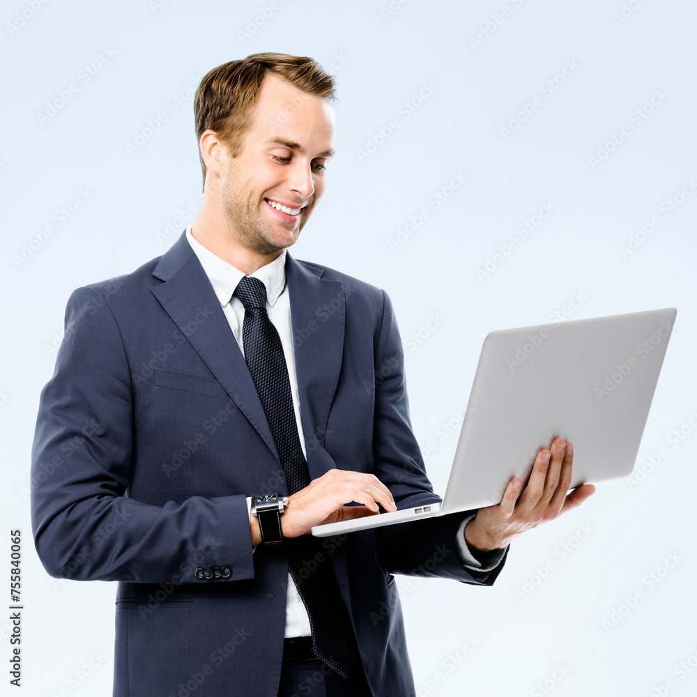 Happy smile business man in gray suit, necktie using laptop, isolated grey wall background, copy space area for ad text. Businessman hold notebook computer at studio concept square image. Happy smile business man in gray suit, necktie using laptop, isolated grey wall background, copy space area for ad text. Businessman hold notebook computer at studio concept square image.