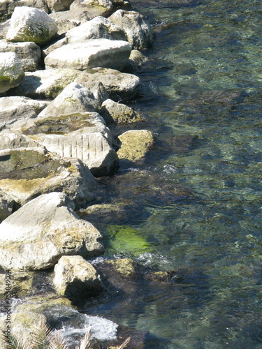 Line of sun-bleached rocks by the sea