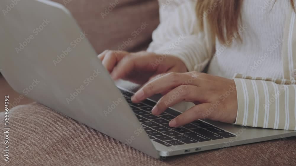 Close-up of woman typing on laptop. Working from home on a laptop Close-up of woman typing on laptop. Working from home on a laptop