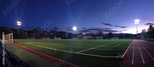 Lights shine brightly on the stadium football