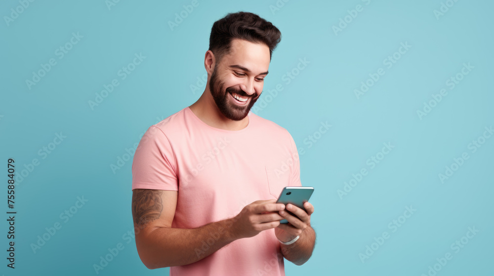 Man smiling and holding her smartphone on a blue background Man smiling and holding her smartphone on a blue background