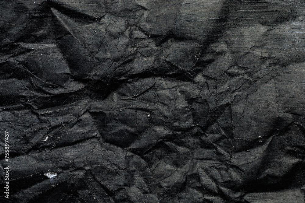 Crumpled paper canvas painted with black paint. Blank for design, graphic resource Crumpled paper canvas painted with black paint. Blank for design, graphic resource