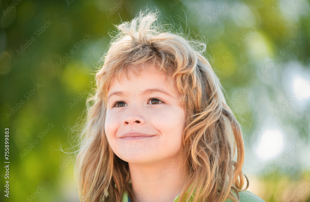 Close-up portrait of a cute little boy in spring park. Happy kid having fun outdoors. Childhood concept. Close-up portrait of a cute little boy in spring park. Happy kid having fun outdoors. Childhood concept.