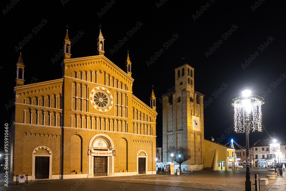 Night view of Cathedral of Piove di Sacco and Carrarese Tower at Piazza Incoronata (Incoronata Square); Veneto, Italy