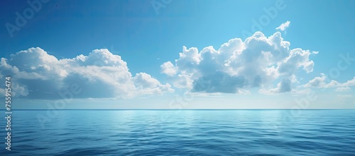 Captivating images capture the serene blue sea under a breathtakingly beautiful sky  a scene of tranquil perfection