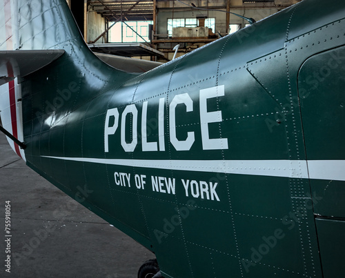 police city of new york sign on the side of vintage antique airplane body photo