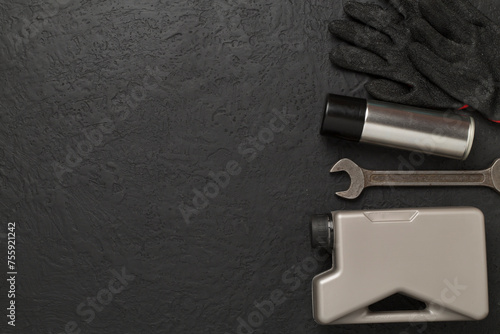 Car tools and accessories on concrete background, top view