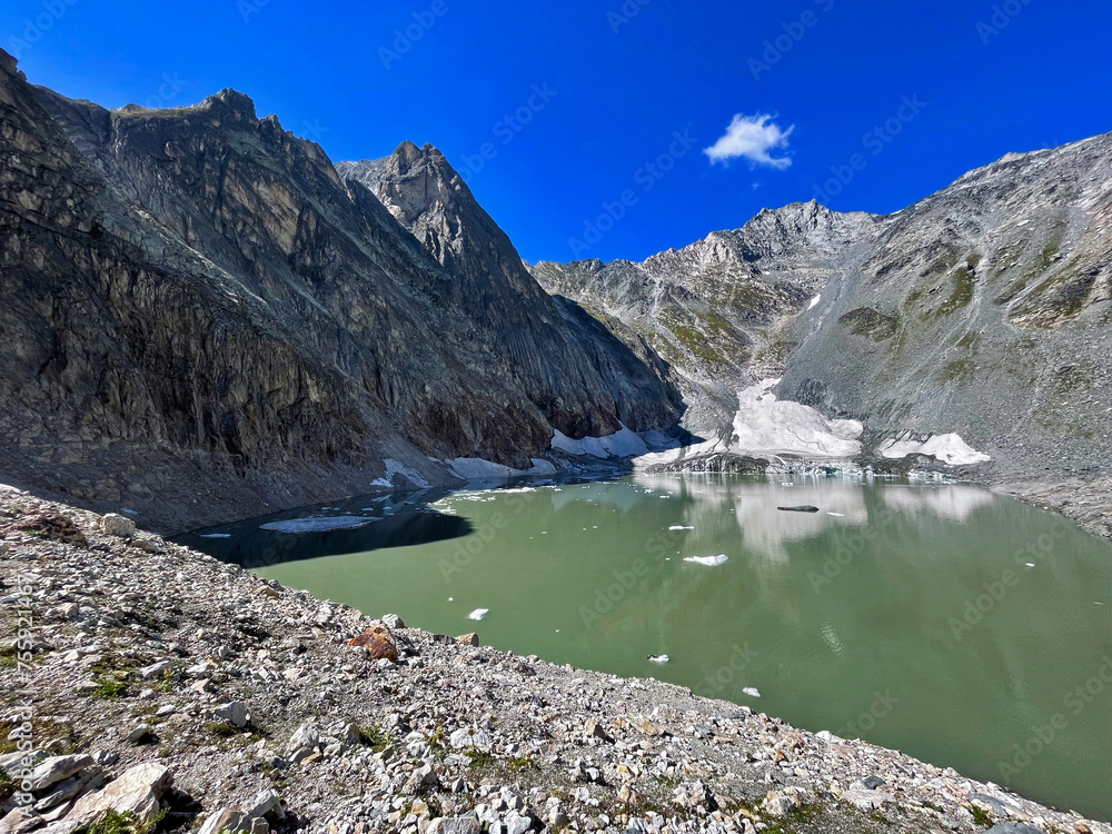 Obraz premium Alpine Oasis: Glacier Lake Majesty in Vanoise National Park, Hautes Alps, France