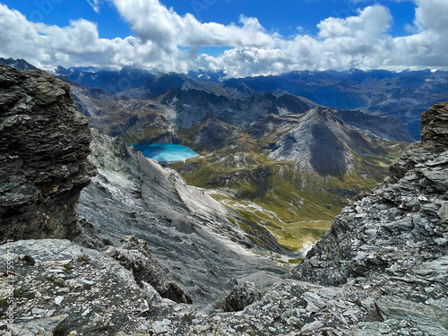 Peak Perspectives: Alpine Trail by Lake in Val d'Isere, aiguille de la grande sassière, France