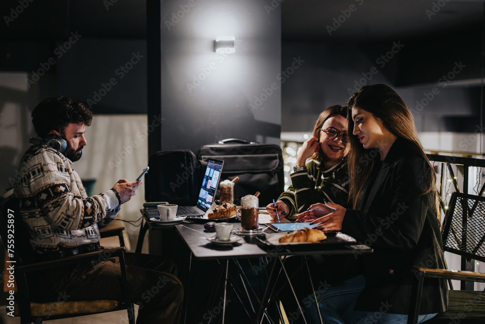 A group of friends enjoys a casual evening at an outdoor cafe, engaged in conversation and digital devices with soft lighting. A group of friends enjoys a casual evening at an outdoor cafe, engaged in conversation and digital devices with soft lighting.