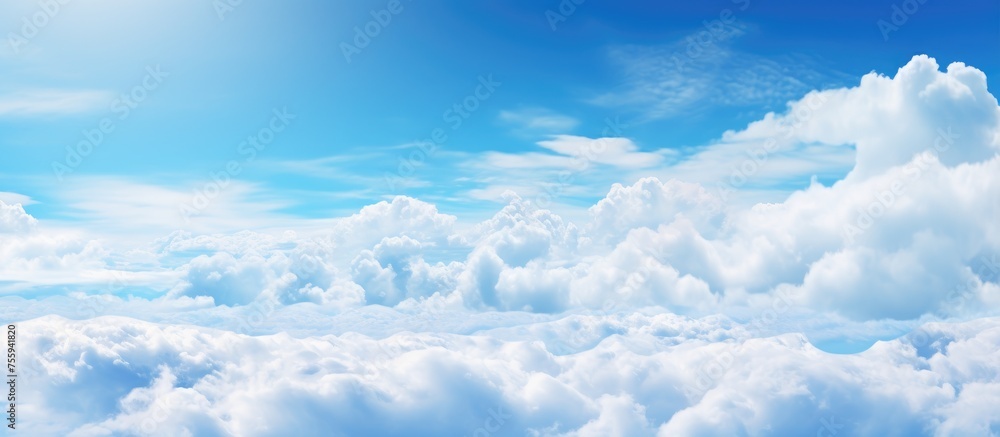 The electric blue sky is adorned with fluffy white cumulus clouds, creating a serene natural landscape. The horizon stretches infinitely, with the wind gently moving the clouds across the atmosphere The electric blue sky is adorned with fluffy white cumulus clouds, creating a serene natural landscape. The horizon stretches infinitely, with the wind gently moving the clouds across the atmosphere