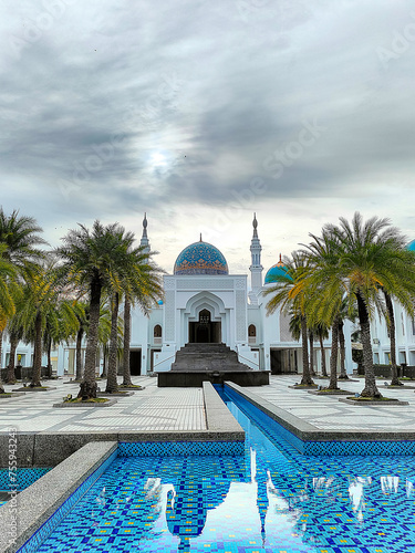 Photos Al-Bukhary public mosque in Alor Setar a modern architecture and unique manmade building during during sunset with view of blue pond in front