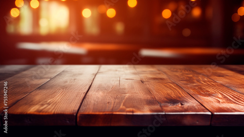 Old wooden table in dark blurred bar background. Copy space © xamtiw