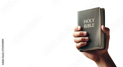 Hand holding the holy bible. Isolated transparent PNG background. Salvation through the holy scriptures concept. With copy space. Faith, Salvation, Peace, Prophecy, Grace.