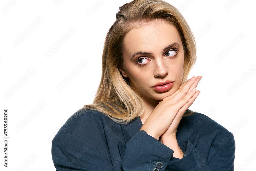 good looking blonde woman in elegant blue blazer posing on white background and looking away good looking blonde woman in elegant blue blazer posing on white background and looking away