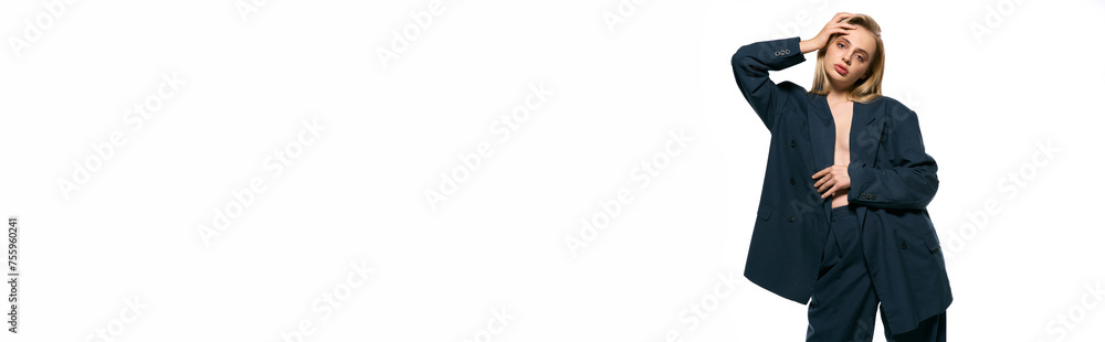 alluring sexy woman with blonde hair in unbuttoned suit on white backdrop looking at camera, banner alluring sexy woman with blonde hair in unbuttoned suit on white backdrop looking at camera, banner
