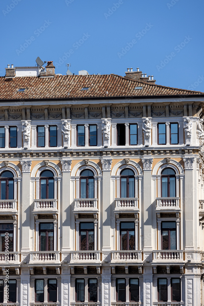 Decorative facade of Model palace located on Unity of Italy Square, Trieste, Italy