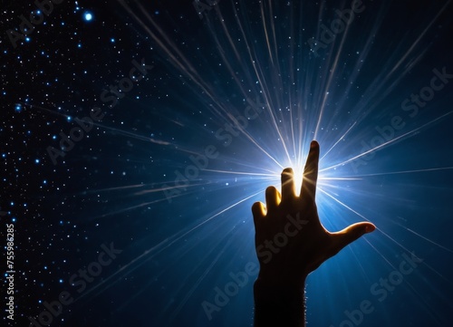 a hand is reaching up towards the stars in the sky 
