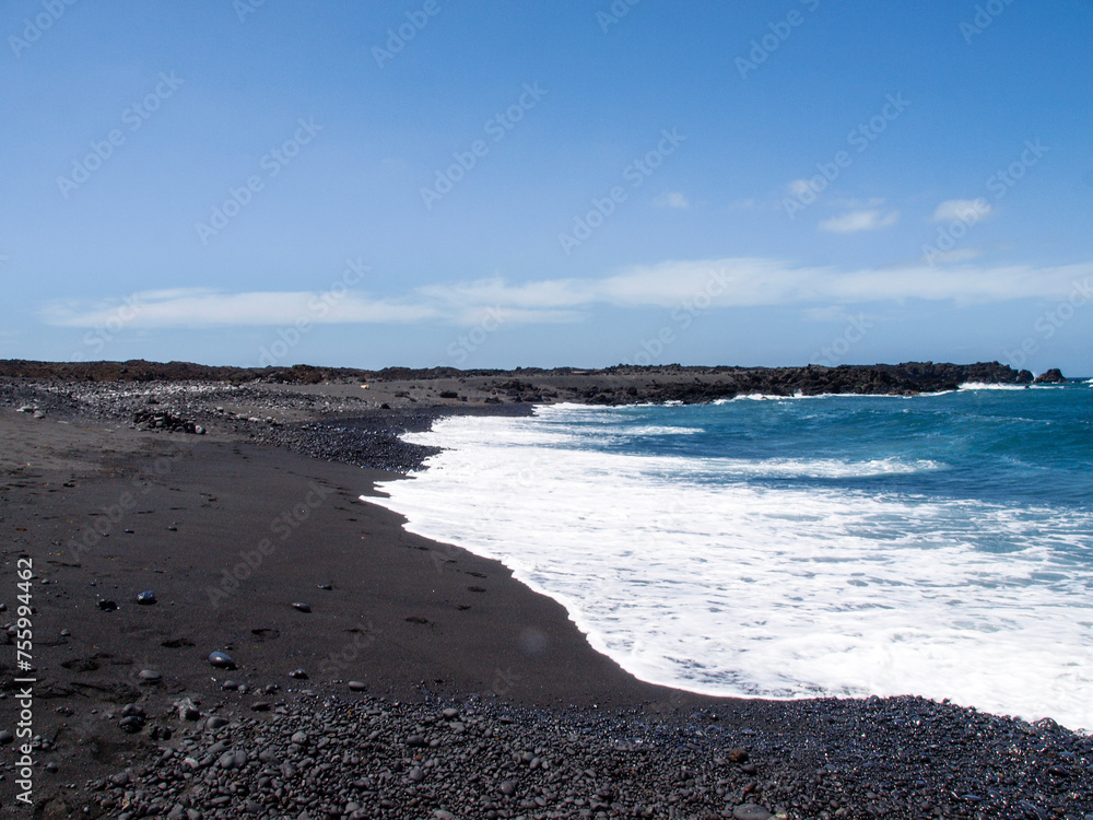 Typical black sand beach of volcanic origin Typical black sand beach of volcanic origin