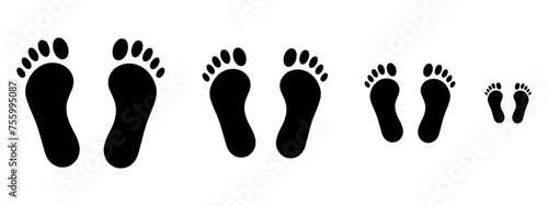 big and little footprints in the sand illustration isolated in a light brown background.