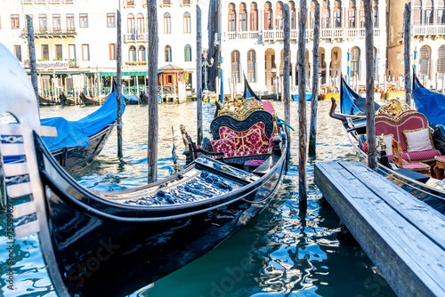 Docked Gondolas on Grand Canal with Venetian Architecture photo