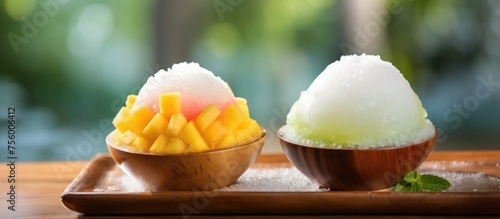 Traditional dessert made with two bowls of shaved ice topped with various ingredients, served on a wooden tray. A staple food in many Asian cuisines photo