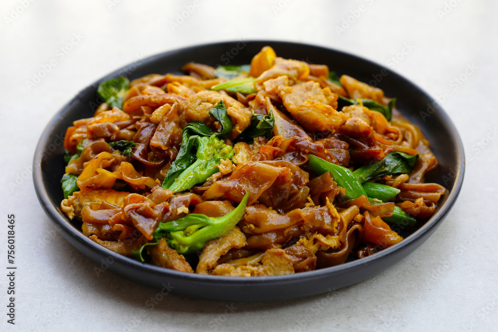 Stir-fried rice noodles with soy sauce and pork Stir-fried rice noodles with soy sauce and pork