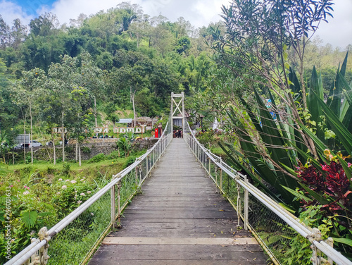 a view of taman kemesraan. indonesia spot tourism. beautiful architecture and nature like river, tree and forest. malang, indonesia - 6 maret 2024 photo