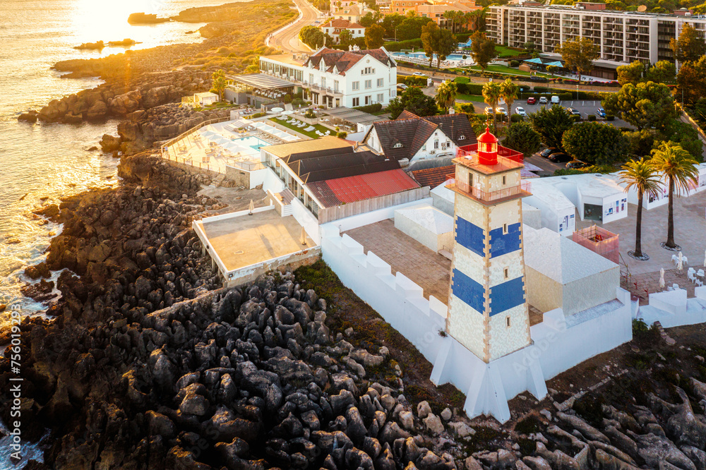 Aerial view of Santa Marta lighthouse, Cascais, Portugal at sunset.
