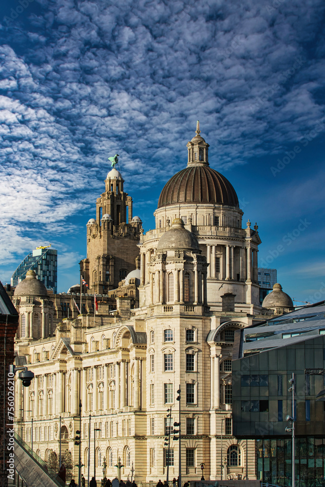 Stunning architecture against a blue sky with dramatic clouds in Liverpool, UK.