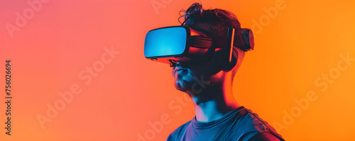 Young man with virtual reality headset. Male in VR glasses on gradient background. VR, AR, metaverse, future, gadgets, technology, education online, study, video game concept. Futuristic technology