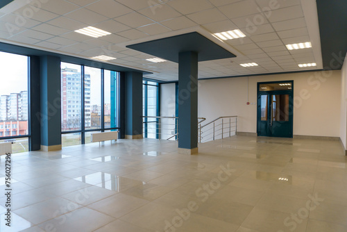 Square lamp on a white office ceiling. Interior design in the office. A fluorescent lamp on a modern suspended ceiling.