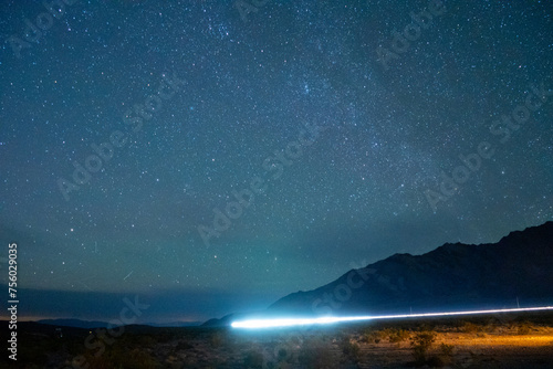 Car tail light trails in the Mojave Desert shortly after sunset photo
