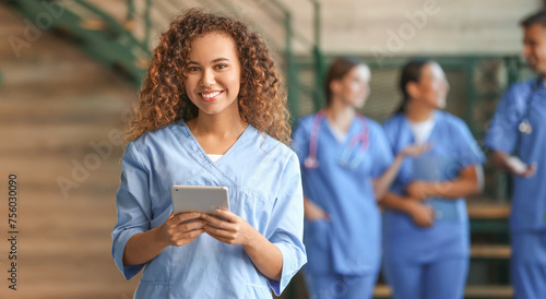 Female African-American medical student with tablet computer in clinic