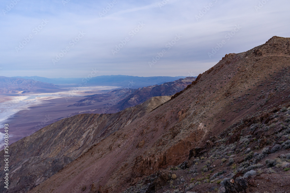 Lake Manly forming in Badwater Basin after heavy rains in Death Valley National Park. Salt flats, snowcapped mountains,  and desert valley views seen from Dante's View.