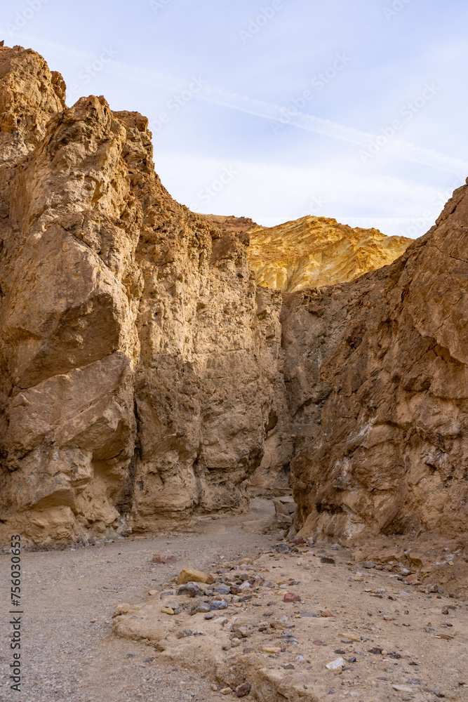 Vivid golden canyon walls caused by erosion in Death Valley National Park