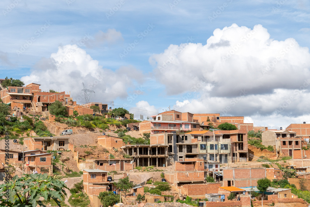 houses built on a hill, hillside settlements, urban development in latin america
